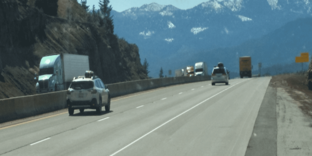 Transportation industry vehicles travelling on the highway.